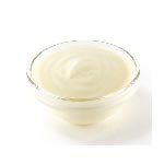 Yellow cream cheese in a small glass bowl